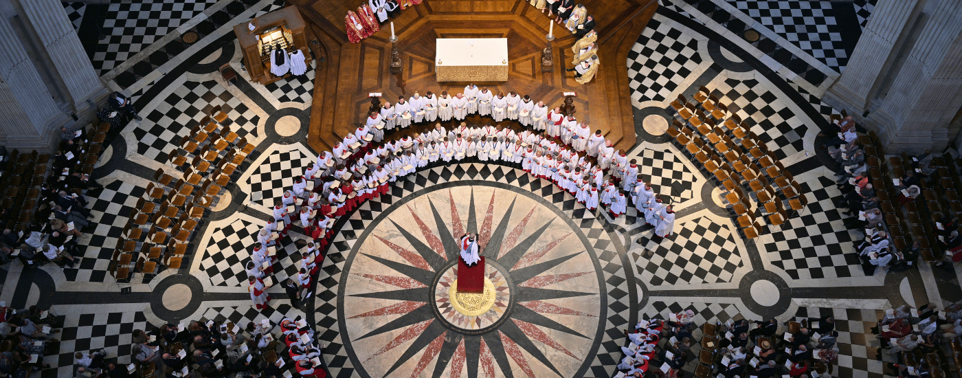 Three choirs, dressed in white robes, singing under the magnificent dome of St Paul's Cathedral. Seen from above, from The Whisper Gallery.