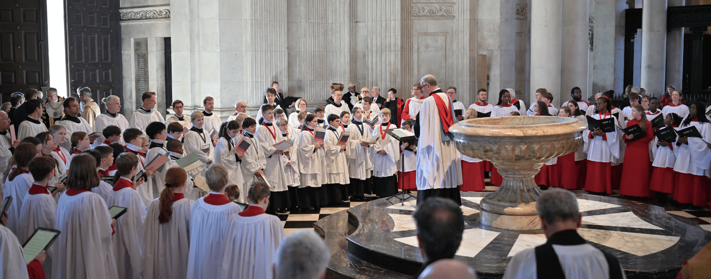 Beside the Font of the West Doors of St Paul's Cathedral, three choirs begin to sing, led by the Director of Music.