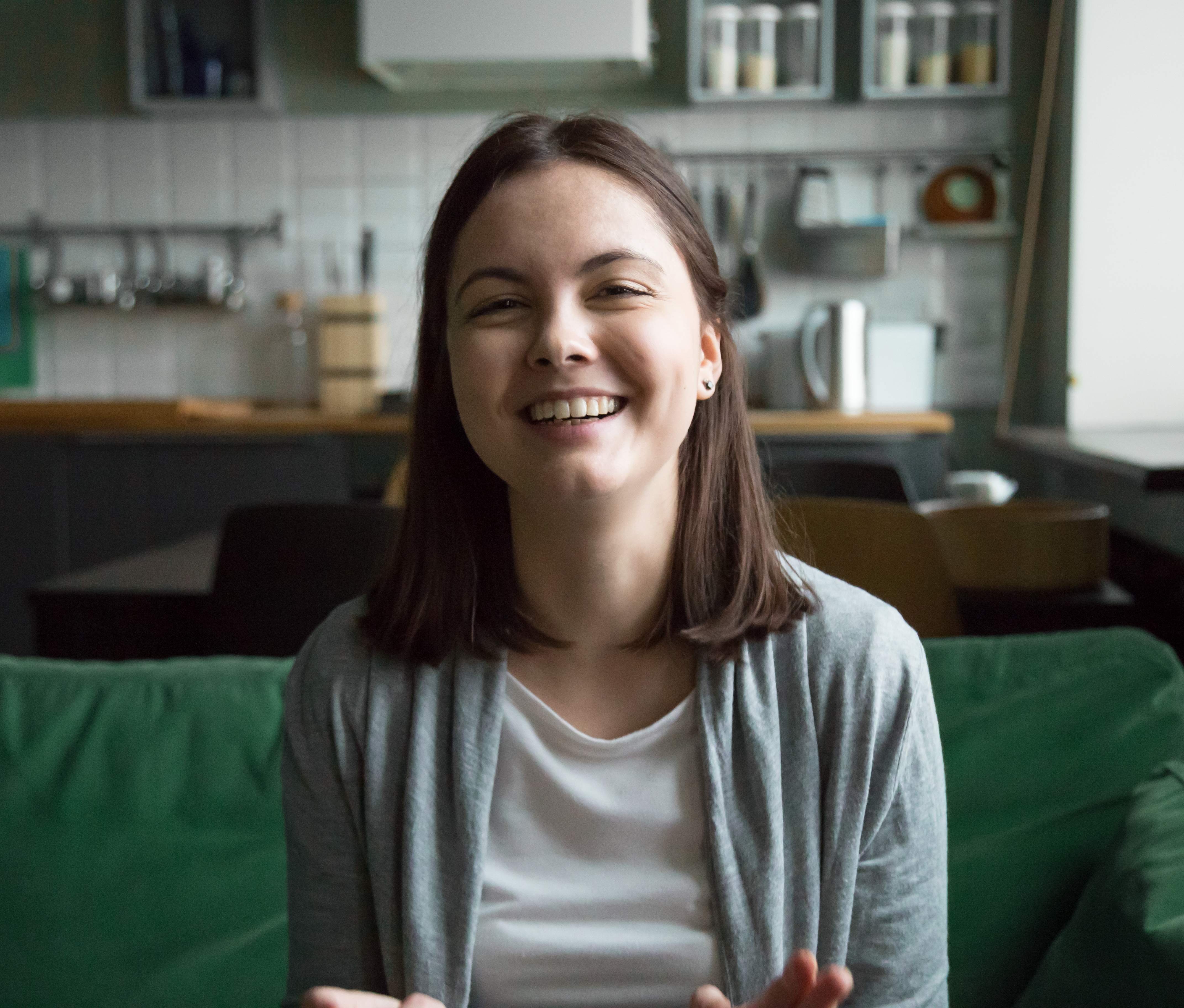 Woman sitting down and smiling