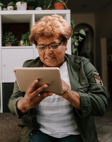 Retired Clergy woman on a tablet