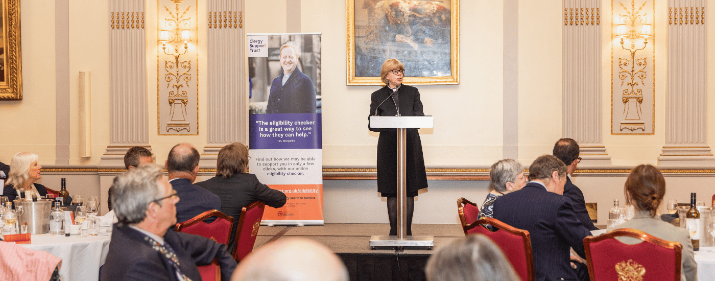 The Archbishop of Canterbury, The Most Revd and Rt Hon Dame Sarah Mullally is addressing a hall of seated guests.
