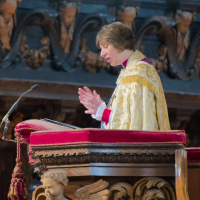 The Rt Revd Rachel Treweek, giving a sermon from a pulpit.