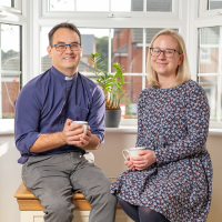 Dan and Laura, enjoying a cup of tea by the window.